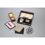 A pair of silver napkin rings, in fitted case, Birmingham 1936, a silver compact, Birmingham 1936, a