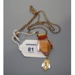 An 18ct gold mounted banded agate pendant suspending a crest drop to a 9ct gold open link chain,