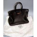 An 'as new' Hermes type black leather Birkin type tote bag with gilt metal clasps, padlocks and