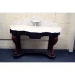 A part Victorian mahogany Duchess washstand, the serpentine fronted marble top over frieze drawer on