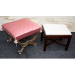 A giltwood X frame stool, the salmon overstuffed seat with bee detail, on scrolled legs united by