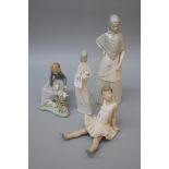 A Nao porcelain figure of a young bride, a group of seated lady and rabbits, a seated ballerina, and