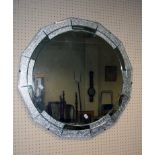 A 1930's Art Deco wall mirror with central circular plate and twelve peripheral clear/ frosted