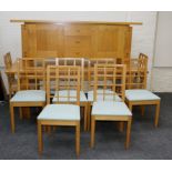 Manner of Gordon Russell, a circa 1980s golden oak dining suite, comprising rectangular top dining