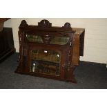 An early 19th century oak drop leaf gateleg dining table, with planked top on turned tapering legs