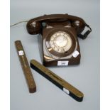 A chocolate brown Bakerlite cradle and dial telephone and two spirit levels, one by Rabone and Sons