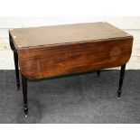 An early 19th century mahogany Pembroke table, the rectangular top and twin flaps with reeded edge