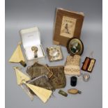 A collector's lot, including two chain purses, a needlework and silver thread purse, two vesta