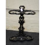 An Edwardian cast iron two division stick stand with acanthus leaf detail, 64cm