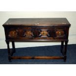 A circa 1900 stained pine low dresser, the rectangular top over a pair of geometrically moulded
