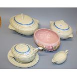 A Clarice Cliff part tea and dinner service, with simple banded decoration, together with a pink '
