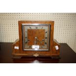 An Art Deco walnut veneered three train mantel clock, with square dial, 30cm wide