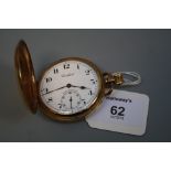 A 9ct gold hunting cased pocket watch, the white enamel dial with Arabic numerals and subsidiary