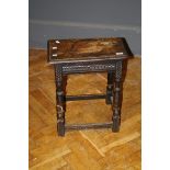 A 17th century style carved oak joint stool with turned supports