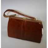 Mappin and Webb, a lizard handbag, suede interior, with a compact, card case, wallet, purse and aide