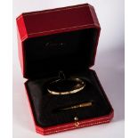 Cartier. A Cartier Love bracelet set with diamonds, the 18ct gold bracelet set with brilliant cut