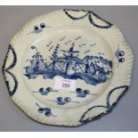 An 18th century probably North Country blue and white pearlware plate. Painted with a pagoda
