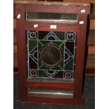 A Victorian stained and leaded panel, the central roundel with cockatoo decoration, 34cm wide