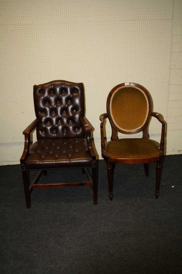 A deep buttoned leather upholstered Gainsborough armchair and one other chair