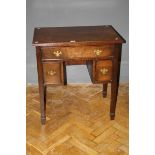 A George III style mahogany kneehole side table with square supports, 72cm wide