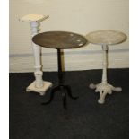 A George III mahogany oval top pillar table, together with a cast iron circular wooden top table and