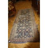 An antique Azerbaijan long rug (a remnant), 128 x 286cm