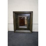 A large decorative floral painted wall mirror, 107cm wide