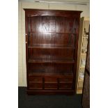 A mahogany open bookcase with drawers below, 117cm wide