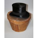 A Lincoln Bennet and Co of London French silk top hat with leather travel case