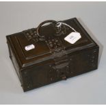 A Germanic 16th century style patinated brass table casket with shaped strap work and swing