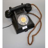 A 1950s vintage black Bakelite dial telephone