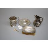 A Victorian silver christening mug with embossed panels, together with other small items of