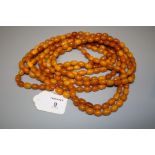 A single row amber bead long chain, the small oval beads of uniform size, approx 300cm, 130.4g