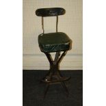 A vintage green painted metal machinists chair