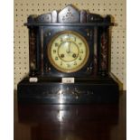 A late Victorian black marble 8 day mantel clock, of architectural form, 32cm wide