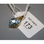 A single stone blue topaz heart-shaped pendant, in three claw 9ct gold pierced and tapered mount