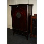A 19th century Chinese lacquer two door marriage cupboard, drawers fitted to base, 105cm wide