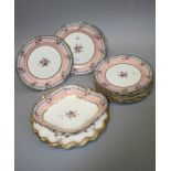 A set of nine Aynsley rose decorated pink ground dessert plates, a conforming lozenge shape dish and