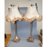 A pair of contemporary boudoir table lamps, each with hand embroidered frilled shade on reeded