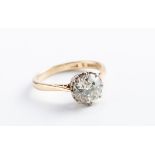 A single stone diamond ring, the old brilliant cut diamond in eight claw mount, to plain 18ct gold