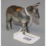 An Edwardian novelty silver pin cushion, in the form a well modelled standing donkey, Birmingham