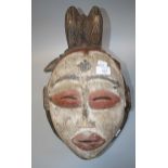 A carved wood African 'Puna' mask of fox form, 47cm long