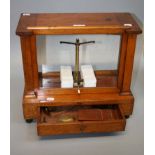 A mahogany cased set of chemist balance scales and weights, 40cm wide