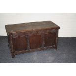 A late 17th century oak three panel coffer, 117cm long