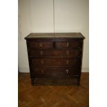 An oak 'Jacobethan' chest of two short over three long drawers, on a turned frame, 107cm wide