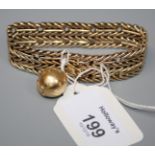 A 9ct gold bracelet, herringbone style links, with a suspended globe drop marked '750', 35.5g
