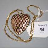 The Jewel Label by Uma Agarwal, a large ruby and diamond set heart pendant, set with bands of