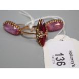 A single stone synthetic pink sapphire ring, marquise shaped in beaded mount with applied leaves