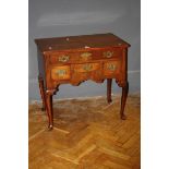 A George III mahogany low boy with re-entrant top and cabriole supports, 75cm