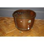 A large 19th century copper log bin with brass lions paw feet